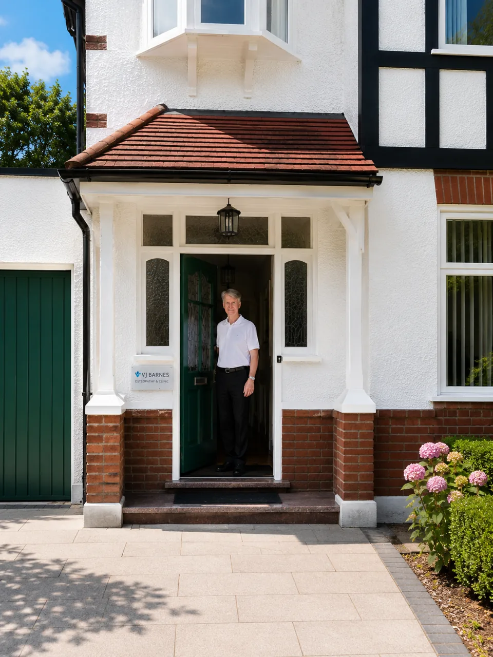 Vincent Barnes standing in the tiled porch at the entrance to the Beckenham clinic